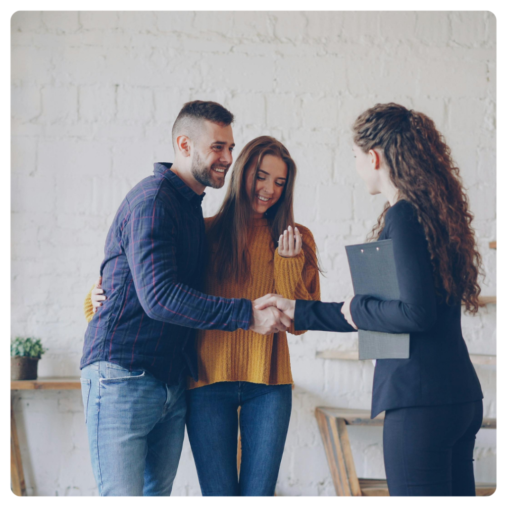 happy couple with insurance agent